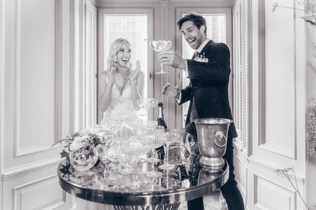 wedding photographer germany bride and groom champagne tower emotional moment